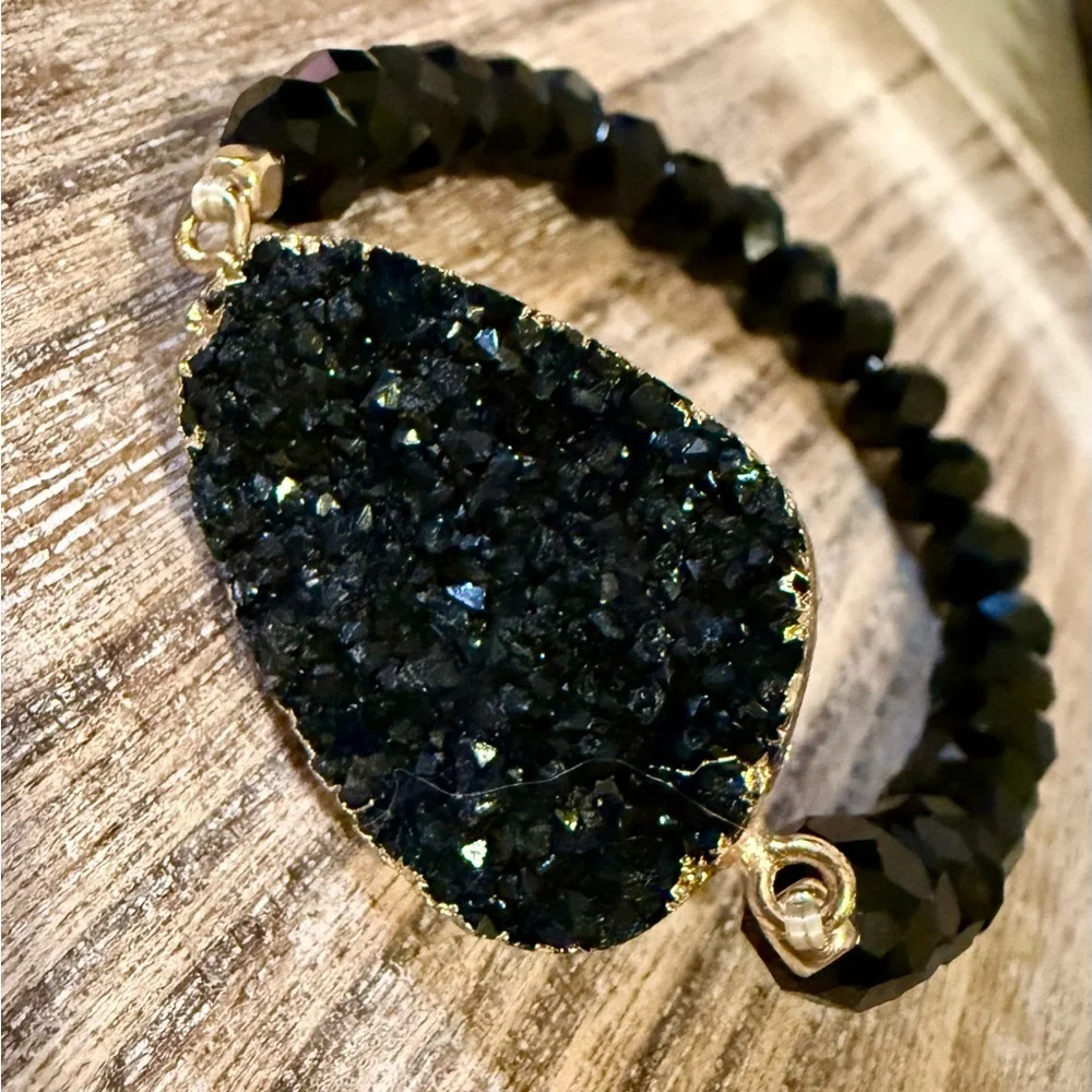 Unique Black Beaded Bracelet with Gold Accents